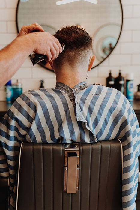 Image of man getting his hair cut